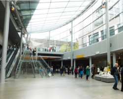 The new entrance building which is started in Sept The new entrance building which is started in September 2015 is made up of a glass structure. It connects the old building and more recent temporary